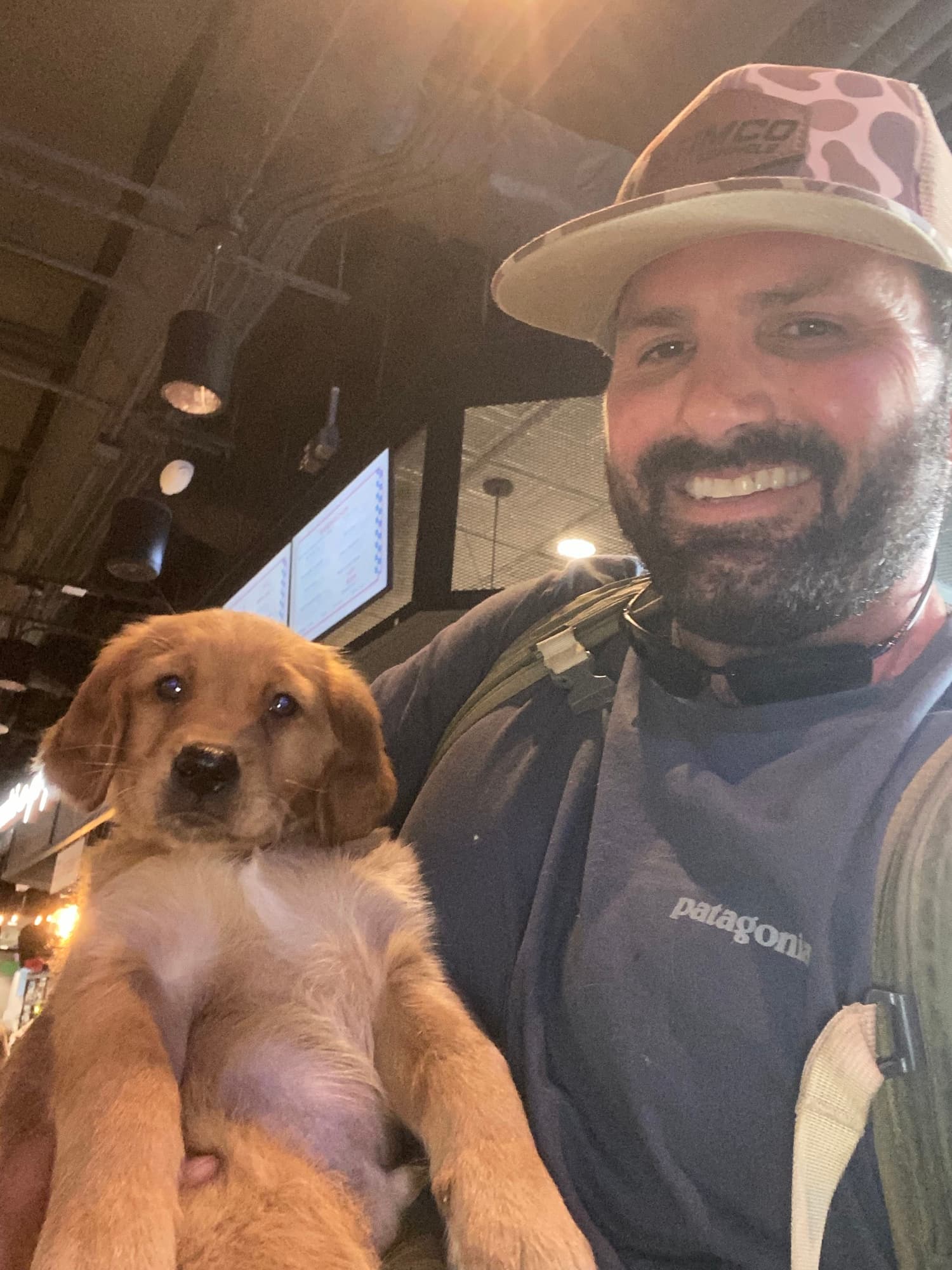 Timothy Caillouet, owner of TIMCO Kennels, with a young retriever